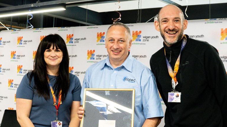 John Warburton receiving the Bronze Patron Certificate at Wigan Youth Zone